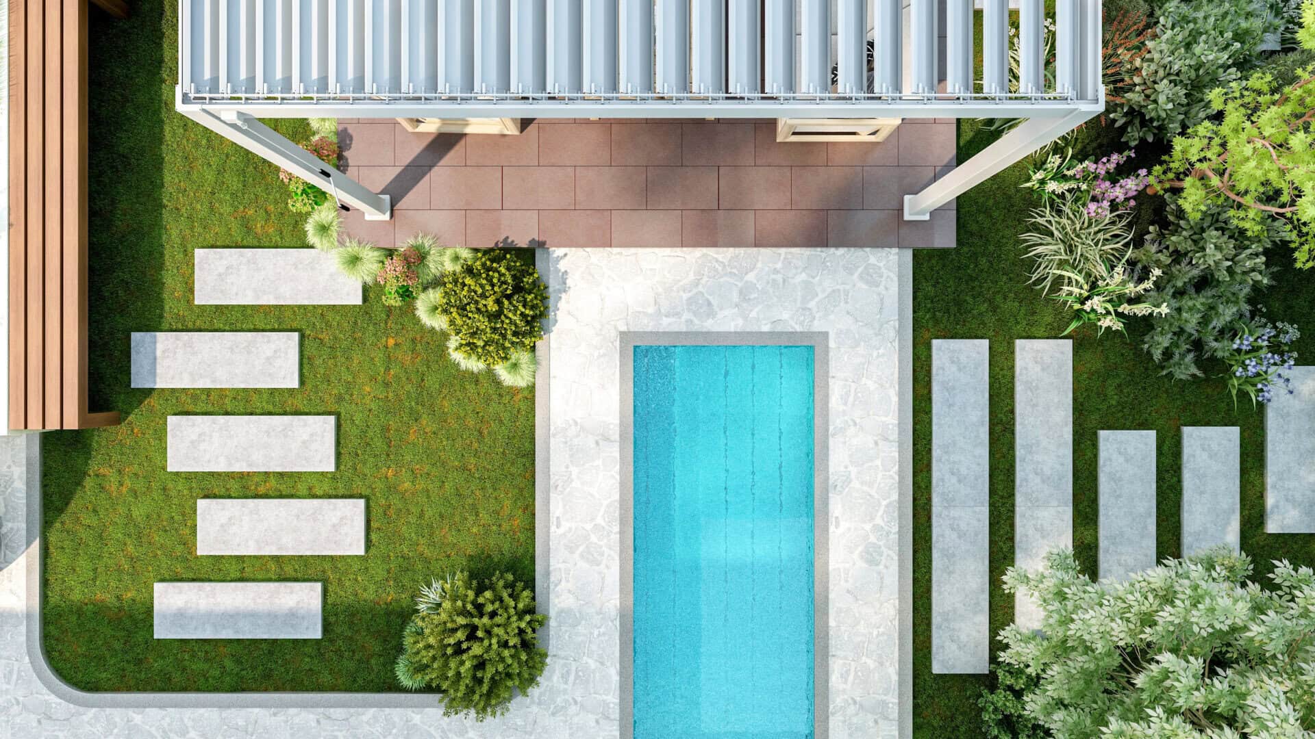 Aerial view of a backyard pool area with paver deck and artificial grass.